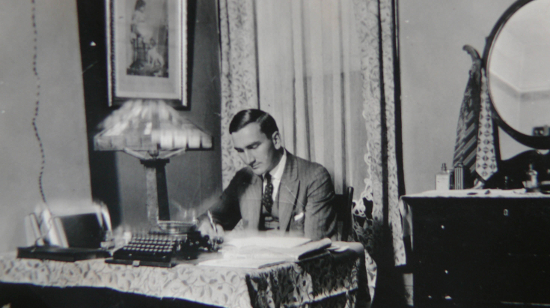 Arthur A. Wishart at a desk